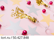 star spangles scattered from glasses with shiny baubles. Стоковое фото, агентство Ingram Publishing / Фотобанк Лори