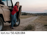 woman posing while traveling alone by car. Стоковое фото, агентство Ingram Publishing / Фотобанк Лори