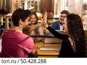 Happy students getting ready for final exams. Стоковое фото, агентство Ingram Publishing / Фотобанк Лори