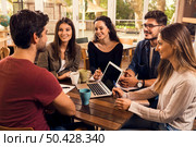 Group of friends studying together for finals. Стоковое фото, агентство Ingram Publishing / Фотобанк Лори