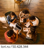 Group of friends studying together for finals. Стоковое фото, агентство Ingram Publishing / Фотобанк Лори