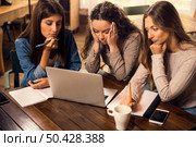 Group of friends studying together and worried with final exams. Стоковое фото, агентство Ingram Publishing / Фотобанк Лори