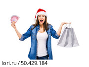Beauitful woman holding shopping bags and some Euro currency notes, isolated over white background. Santa woman with money and shopping bags. Стоковое фото, агентство Ingram Publishing / Фотобанк Лори