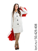Beautiful happy woman holding shopping bags, isolated over a white background. Стоковое фото, агентство Ingram Publishing / Фотобанк Лори