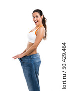 Woman with large jeans in dieting concept. Стоковое фото, агентство Ingram Publishing / Фотобанк Лори