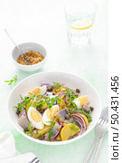 Herring and boiled potato salad with egg, capers and red onion. Стоковое фото, агентство Ingram Publishing / Фотобанк Лори