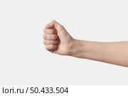 Horizontal finger alphabet sign language spelling A. Female hand with fist raised up isolated on white background. Woman power, strength concept.. Female hand in fist, A letter in sign language horizontal. Стоковое фото, агентство Ingram Publishing / Фотобанк Лори