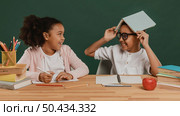 girl boy having fun with school supplies. Стоковое фото, агентство Ingram Publishing / Фотобанк Лори