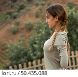 side view woman outdoors nature doing yoga. Стоковое фото, агентство Ingram Publishing / Фотобанк Лори