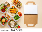 tasty batch food cooked with empty notebook. Стоковое фото, агентство Ingram Publishing / Фотобанк Лори