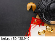new year fortune cookies black teapot. Стоковое фото, агентство Ingram Publishing / Фотобанк Лори