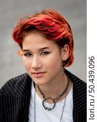 portrait redhead non binary person smiling. Стоковое фото, агентство Ingram Publishing / Фотобанк Лори