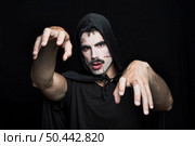 young man with scars pale face halloween costume posing studio. Стоковое фото, агентство Ingram Publishing / Фотобанк Лори