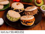 assortment arepas with filling plate. Стоковое фото, агентство Ingram Publishing / Фотобанк Лори