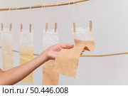 person placing pigmented cloths dry. Стоковое фото, агентство Ingram Publishing / Фотобанк Лори