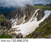 Snow drifts in the foothills of the mountains. Стоковое фото, фотограф Саблин Станислав / Фотобанк Лори