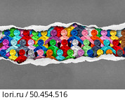 Discovering Diverse Culture and social justice inclusion as a group of people from different cultures under torn paper as a symbol for a united society or workplace unity. Стоковое фото, агентство Ingram Publishing / Фотобанк Лори