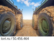 Armored personnel carrier wheels in the mud at field. Стоковое фото, агентство Ingram Publishing / Фотобанк Лори