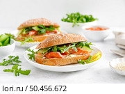 Sandwiches with salted salmon, arugula and cucumber. Breakfast. Стоковое фото, агентство Ingram Publishing / Фотобанк Лори