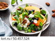 Persimmon fruit salad with blueberry, pecan nuts and ricotta chesse. Healthy food. Top view. Стоковое фото, агентство Ingram Publishing / Фотобанк Лори