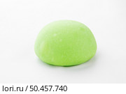 Japanese green mochi dessert on clean white background. Minimalist food photography with bright colors. Ideal for ads, design templates, and culinary content. Стоковое фото, фотограф Aleksandr Gavrilychev / Фотобанк Лори