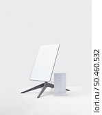 KYIV, UKRAINE - JANUARY 24, 2023: Starlink antenna and wi-fi router on white background. Редакционное фото, агентство Ingram Publishing / Фотобанк Лори