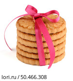 Festive wrapped rings biscuits pile isolated on a white background. Стоковое фото, агентство Ingram Publishing / Фотобанк Лори