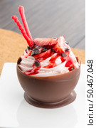 Tasteful strawberry and chocolate pastry mousse on white plate background. Стоковое фото, агентство Ingram Publishing / Фотобанк Лори
