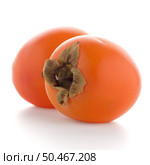 Persimmon fruits on white background. Стоковое фото, агентство Ingram Publishing / Фотобанк Лори