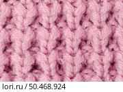 Pink knitted wool texture can use as background. Стоковое фото, агентство Ingram Publishing / Фотобанк Лори