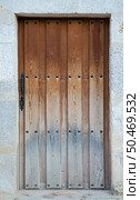 Old wooden entrance door in Valladolid, "Castilla y Leon", Spain. Стоковое фото, агентство Ingram Publishing / Фотобанк Лори