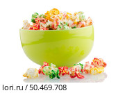 Bowl of popcorn on white reflective background. Стоковое фото, агентство Ingram Publishing / Фотобанк Лори