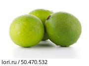 Fresh green limes isolated on white background. Стоковое фото, агентство Ingram Publishing / Фотобанк Лори