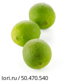 Fresh green limes isolated on white background. Стоковое фото, агентство Ingram Publishing / Фотобанк Лори
