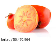 Ripe persimmons on white background. Стоковое фото, агентство Ingram Publishing / Фотобанк Лори