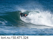 Bodyboarder surfing ocean wave on a sunny winter day. Стоковое фото, агентство Ingram Publishing / Фотобанк Лори