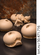 Three delicious meringue on metal tray. Selective focus. Стоковое фото, агентство Ingram Publishing / Фотобанк Лори