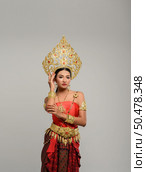 Women wearing Thai clothes and handles on the crown. Стоковое фото, агентство Ingram Publishing / Фотобанк Лори