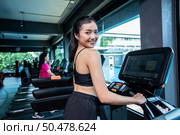 Beautiful fitness women prepare for running at the treadmill in the gym. Стоковое фото, агентство Ingram Publishing / Фотобанк Лори