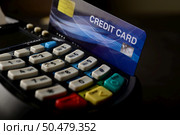 Swipe credit cards in stores to pay for goods and services. Стоковое фото, агентство Ingram Publishing / Фотобанк Лори