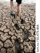 Children are walking barefoot on mud,selective focus. Стоковое фото, агентство Ingram Publishing / Фотобанк Лори