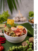 Tom Yum noodle with shrimp and boiled egg, accompanied by lime, cucumber, basil, eggplant and garlic. Стоковое фото, агентство Ingram Publishing / Фотобанк Лори