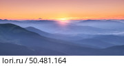 Amazing silhouettes of a mountains at colorful sunset in summer in Ukraine. Landscape with mountain ridges in fog, golden sunlight in the evening. Nature. Hills in sunlight. Scenery	. Стоковое фото, агентство Ingram Publishing / Фотобанк Лори
