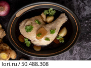 Stewed chicken drumsticks, galangal, garlic and lemon. Selective focus. Стоковое фото, агентство Ingram Publishing / Фотобанк Лори
