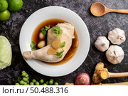 Stewed chicken drumsticks, galangal, garlic and lemon. Selective focus. Стоковое фото, агентство Ingram Publishing / Фотобанк Лори