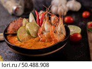 Tom yum with shrimp and crab with lime, chili, tomato, garlic, lemongrass and kaffir lime leaves. Стоковое фото, агентство Ingram Publishing / Фотобанк Лори