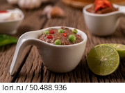 Nam phrik kapi  with Chili and Lemon on wooden floor. Стоковое фото, агентство Ingram Publishing / Фотобанк Лори