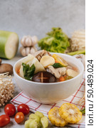 Chicken soup with corn, shiitake mushroom, enoki mushroom, and carrot. Стоковое фото, агентство Ingram Publishing / Фотобанк Лори