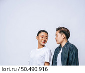 Couple women standing and looking at each other. Стоковое фото, агентство Ingram Publishing / Фотобанк Лори