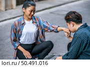 The woman of two lovers sat and kissed the hand of one another. Стоковое фото, агентство Ingram Publishing / Фотобанк Лори